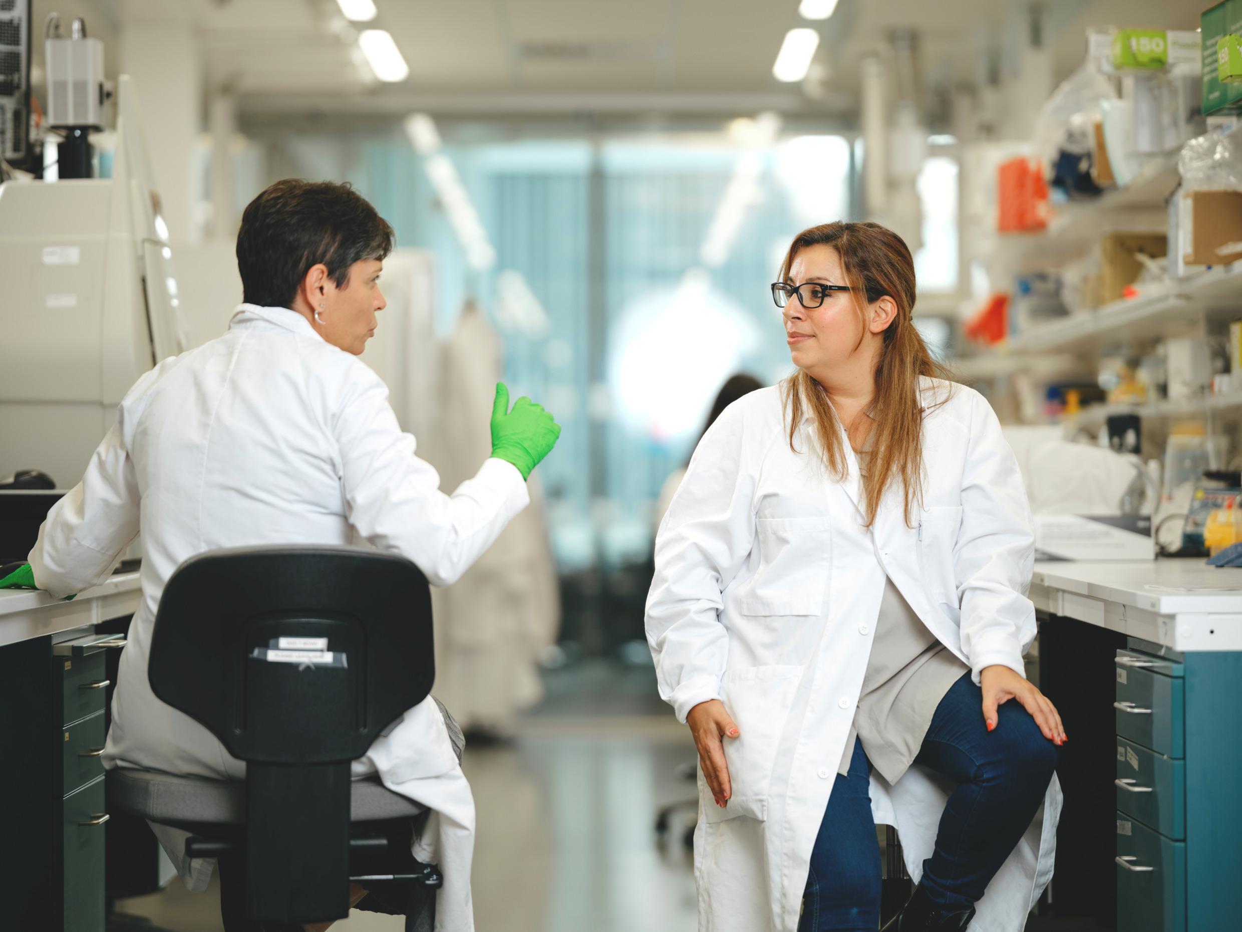 Two researchers in a medical setting.